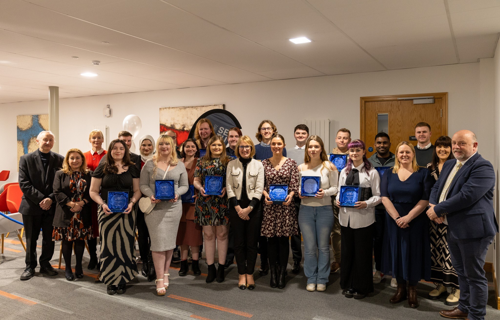 A collection of people gathered to celebrate the President’s Volunteer Awards in SETU Waterford